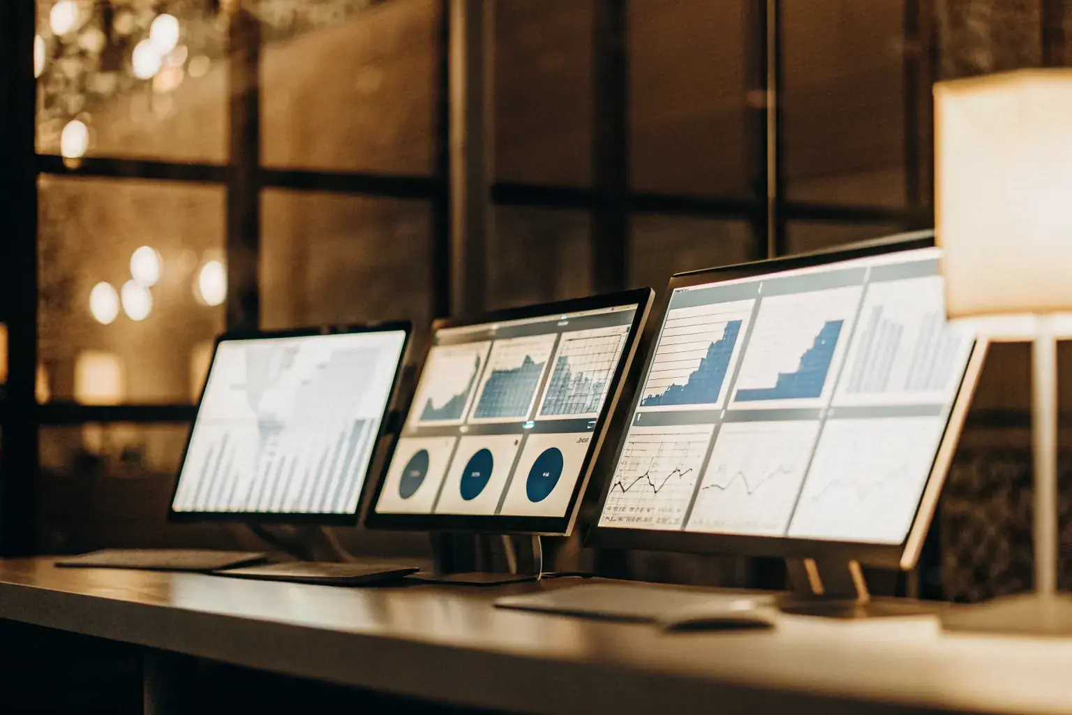 Backlink submission agency team reviewing get back links strategy on analytics dashboards